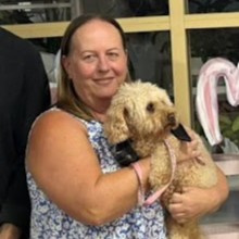 Janice admiring her PolyPets charm